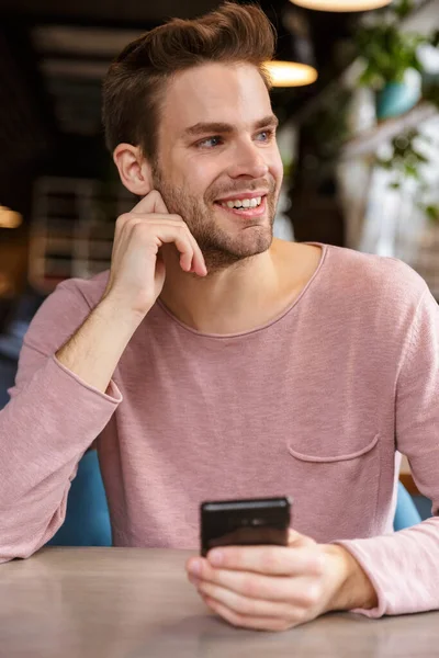 Attractive Young Man Using Mobile Phone While Sitting Cafe Table — Stock Photo, Image