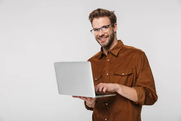 Portrait Cheerful Young Man Wearing Eyeglasses Using Laptop Smiling Isolated — Stock Photo, Image