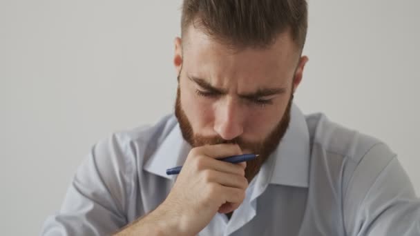 Concentrated Serious Young Bearded Man Wearing Shirt Working Sitting Table — Stock Video