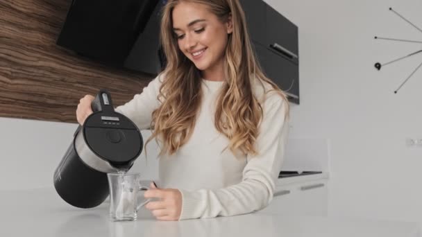 Smiling Young Blonde Woman Making Tea Kitchen — Stock Video