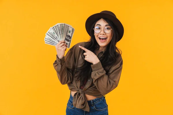 Excited Young Asian Woman Showing Money Banknotes While Standing Isolated — Stock Photo, Image