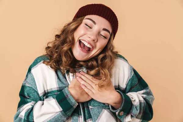 Photo Pretty Excited Woman Knit Hat Holding Her Hands Chest — Stock Photo, Image