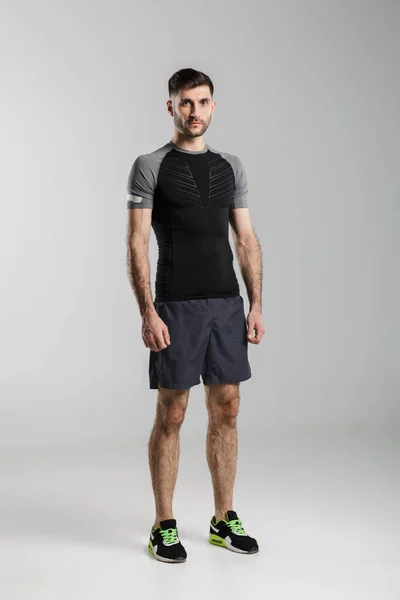 Image Young Strong Man Sportswear Posing Looking Camera Isolated Gray — Stock Photo, Image