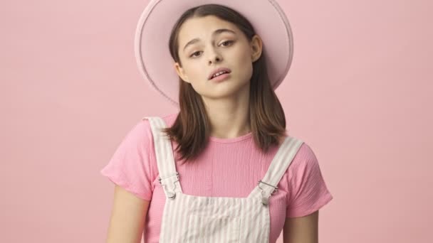 Pensive Pretty Brunette Woman Overalls Hat Looking Disagreeing Something Pink — Stock Video