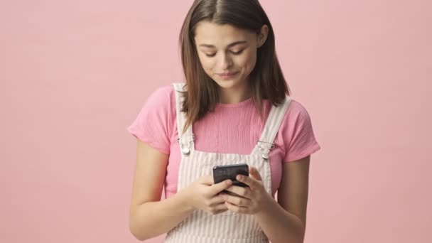 Happy Pretty Brunette Woman Overalls Using Smartphone Becoming Upset Pink — Stock Video