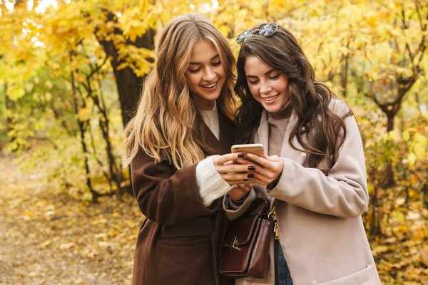 Two Cheerful Young Pretty Girls Wearing Coats Walking Together Autumn — Stock Photo, Image