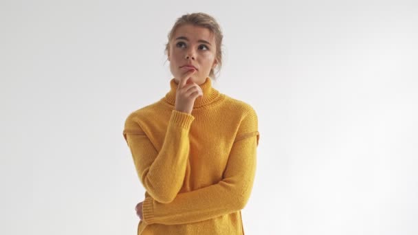 Pensive Pretty Blonde Woman Sweater Looking Away Shrugging Her Shoulders — Stock Video