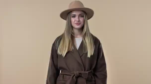 Confident Smiling Young Woman Wearing Hat Coat Showing Thumb Gesture — Stock Video