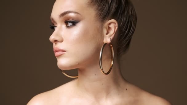 Beautiful Young Half Naked Woman Wearing Stylish Earrings Turning Her — Stock Video