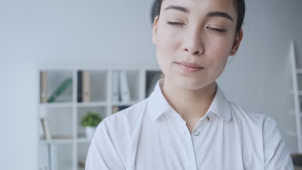 Serious Young Asian Businesswoman Thinking Something While Sitting White Office — Stock Video