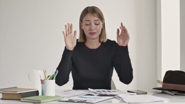 Serious Young Blonde Woman Hiding Her Ears Showing Nonsense Content — Stock Video