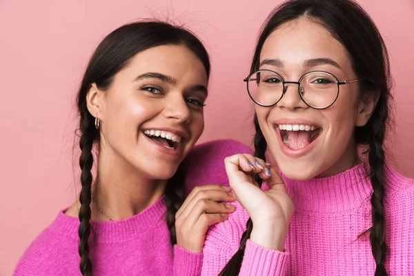 Two Cheerful Cute Teenage Girls Having Fun Isolated Pink Background — Stock Photo, Image