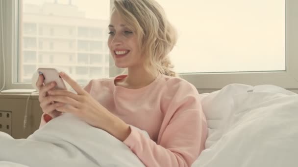 Happy Cheerful Blonde Woman Indoors Home Using Mobile Phone — Stock Video