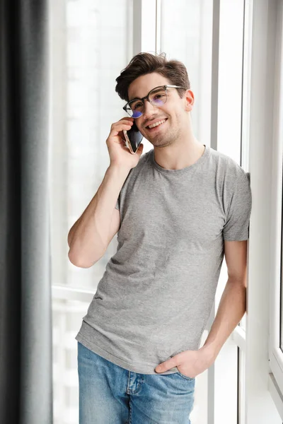 Smiling Young Attractive Man Wearing Casual Clothes Talking Mobile Phone — Stock Photo, Image