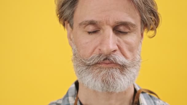 Senior Serious Man Isolated Yellow Background Looking Camera — Stock Video