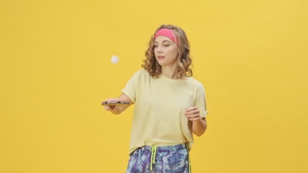 Focused Young Athletic Woman Sportswear Playing Ping Pong Isolated Yellow — Stock Video