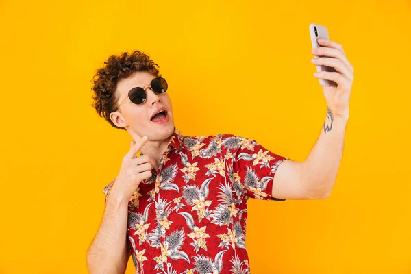 Image Young Delighted Man Taking Selfie Pointing Finger Cellphone Isolated — Stock Photo, Image