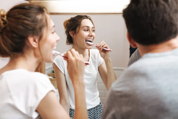 Image Attractive Couple Smiling While Cleaning Teeth Together Bathroom Brush — Stock Photo, Image