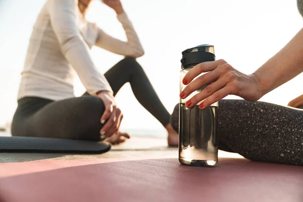 Cropped Image Caucasian Fitness Women Sportive Clothes Sitting Yoga Mats — Stock Photo, Image