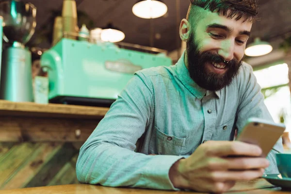 Attractive Smiling Young Bearded Man Wearing Shirt Using Mobile Phone — Stock Photo, Image