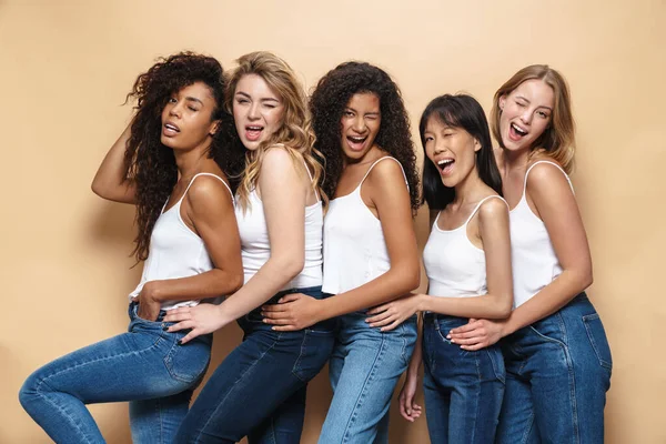 Image Beautiful Multinational Women Blue Jeans Winking Hugging Together Isolated — Stock Photo, Image