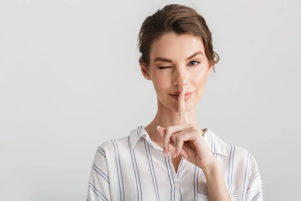 Image Pleased Nice Woman Showing Silence Gesture Winking Isolated White — Stock Photo, Image