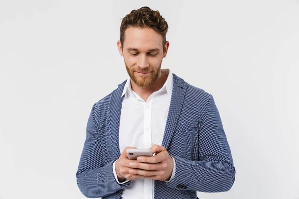 Image Pleased Handsome Man Jacket Smiling Using Smartphone Isolated White — Stock Photo, Image