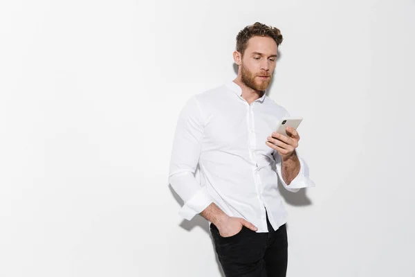 Image Handsome Focused Man Shirt Posing Using Cellphone Isolated White — Stock Photo, Image