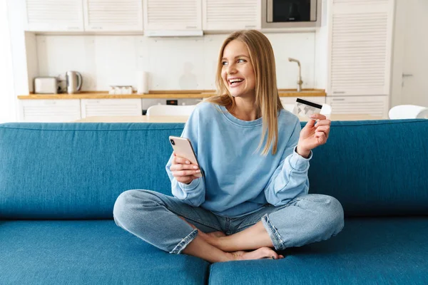 Image Young Smiling Woman Using Smartphone Holding Credit Card While — Stock Photo, Image