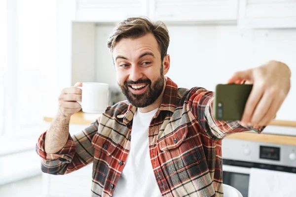 Portrait Smiling Bearded Man Taking Selfie Cellphone Drinking Coffee While — Stock Photo, Image