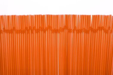 An abstract background line of orange tubules for a cocktail, se