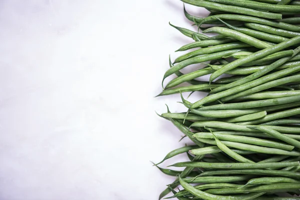 Haricots verts crus cordes, fond de la frontière — Photo