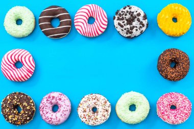 Renkli donut sınır arka plan, üstten görünüm düz koymak