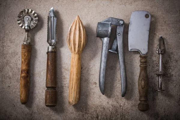 Vintage kitchen utensils on stone slate — Stock Photo, Image
