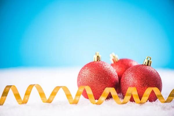 Christmas red balls and golden ribbon — Stock Photo, Image