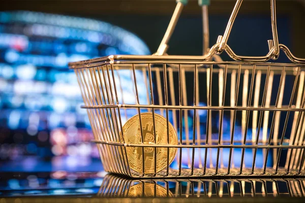 Bitcoin coin in shopping basket — Stock Photo, Image