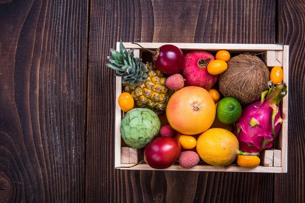 Wooden box with exotic fruits