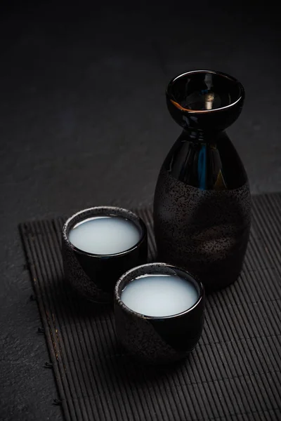 Sake in ceramic bowls, top view — Stock Photo, Image