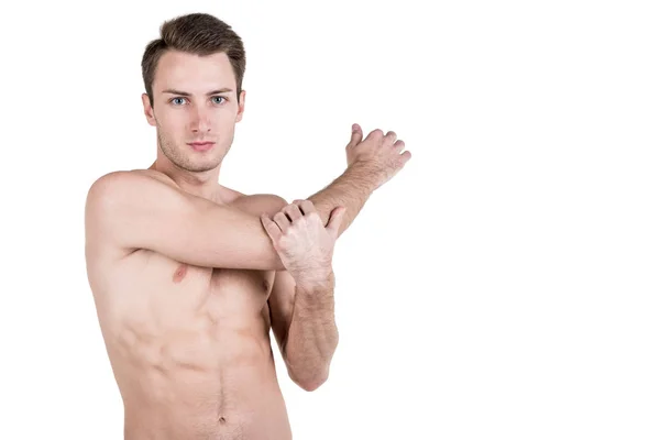 Healthy lifestyle. Portrait of a handsome guy with a sporty naked body, warming up, isolated on white background. Horizontal frame — Stock Photo, Image