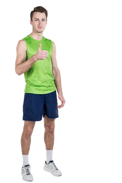 Healthy lifestyle. Portrait of a handsome guy with juice, wearing sportswear, isolated on white background, looking at camera. Vertical frame — Stock Photo, Image