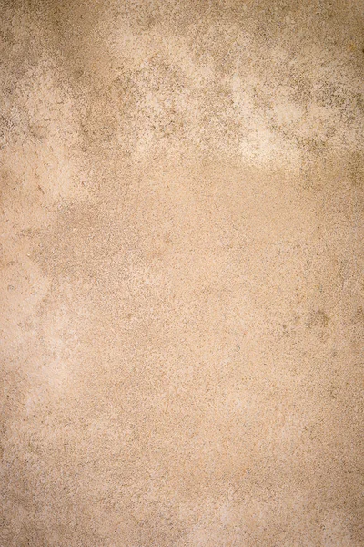 Achtergrond. Het patroon van een oude betonnen beige muur. Verticale frame — Stockfoto
