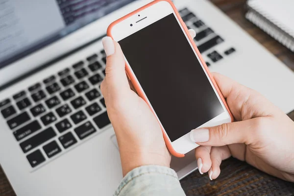 Morning business woman. Laptop and phone in female hands. Horizontal frame Royalty Free Stock Photos