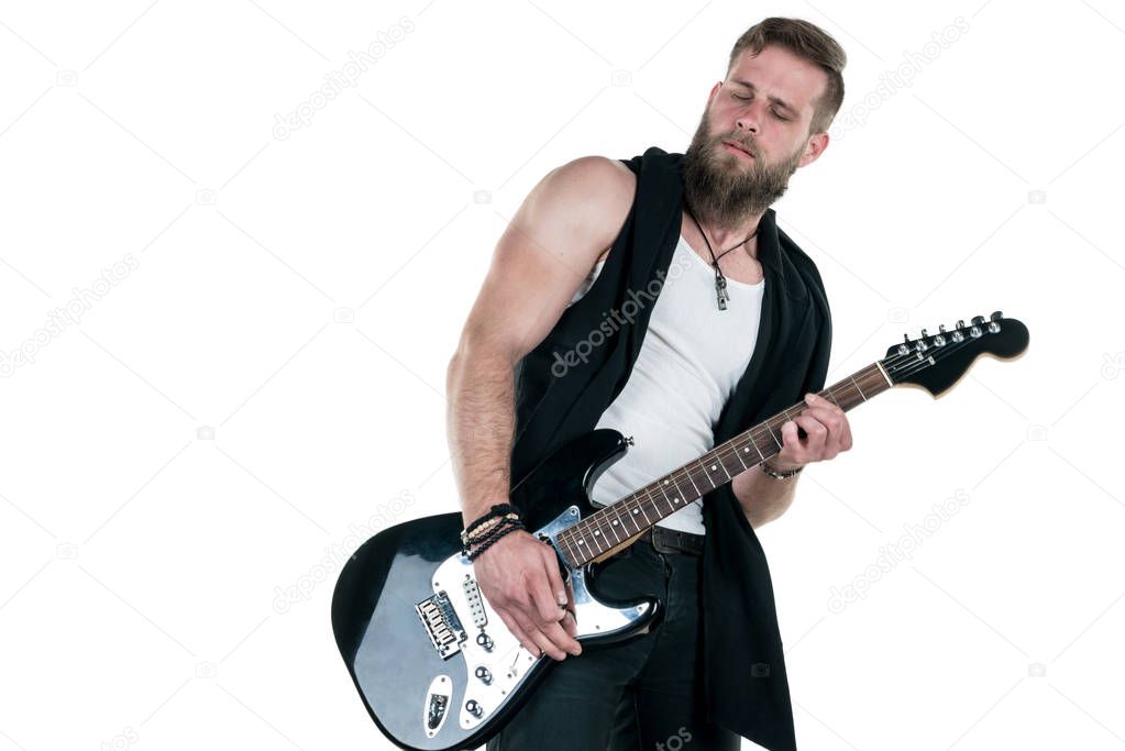 KIEV, UKRAINE - May 03, 2017. Charismatic and stylish man with a beard playing an electric guitar on a white isolated background. Horizontal frame