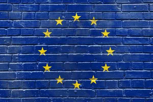 Muro de ladrillo con la imagen de la bandera de la Unión Europea — Foto de Stock