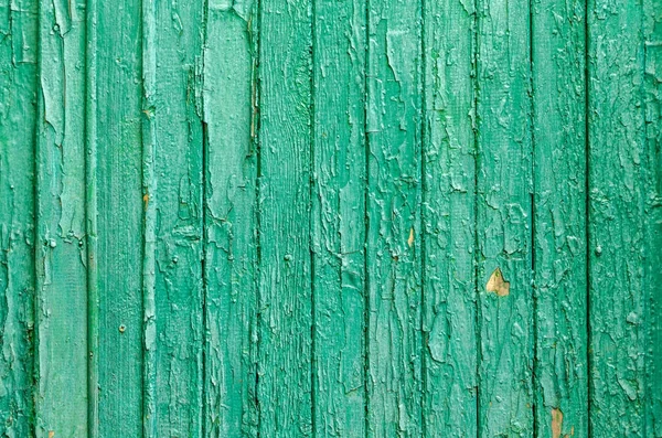 Textura pelar pintura verde en un tablero de madera en todo el marco — Foto de Stock