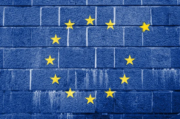 Muro de ladrillo con la imagen de la bandera de la Unión Europea — Foto de Stock