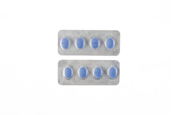 Two plates of blue pills on white isolated background — Stock Photo, Image