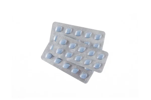 Drie platen van blauwe pillen op witte geïsoleerde achtergrond — Stockfoto