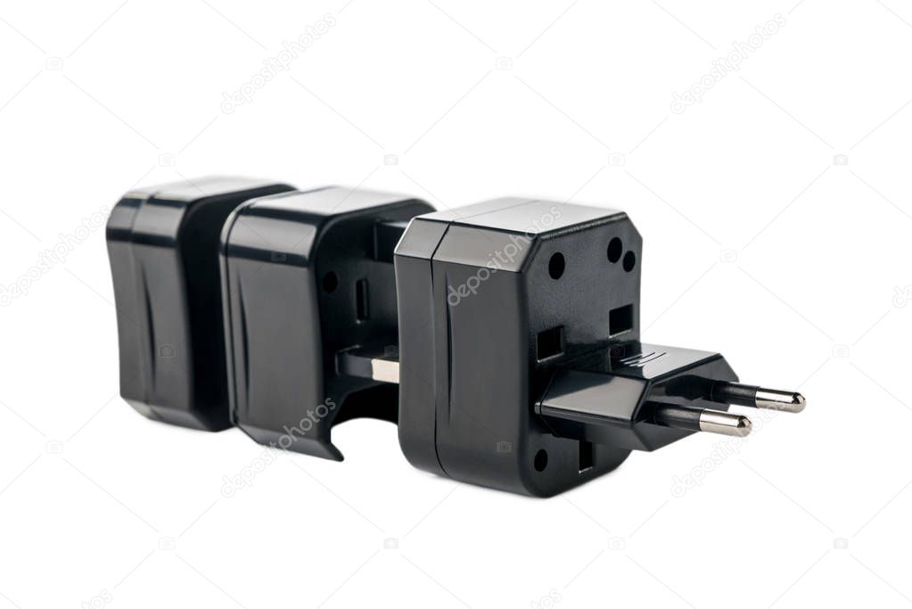 Three black adapters for American and European plug on white isolated background