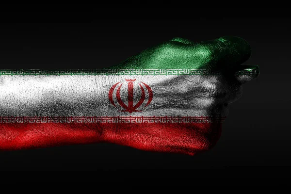 Een hand met een geschilderde Iraanse vlag toont een vijg, een teken van agressio — Stockfoto